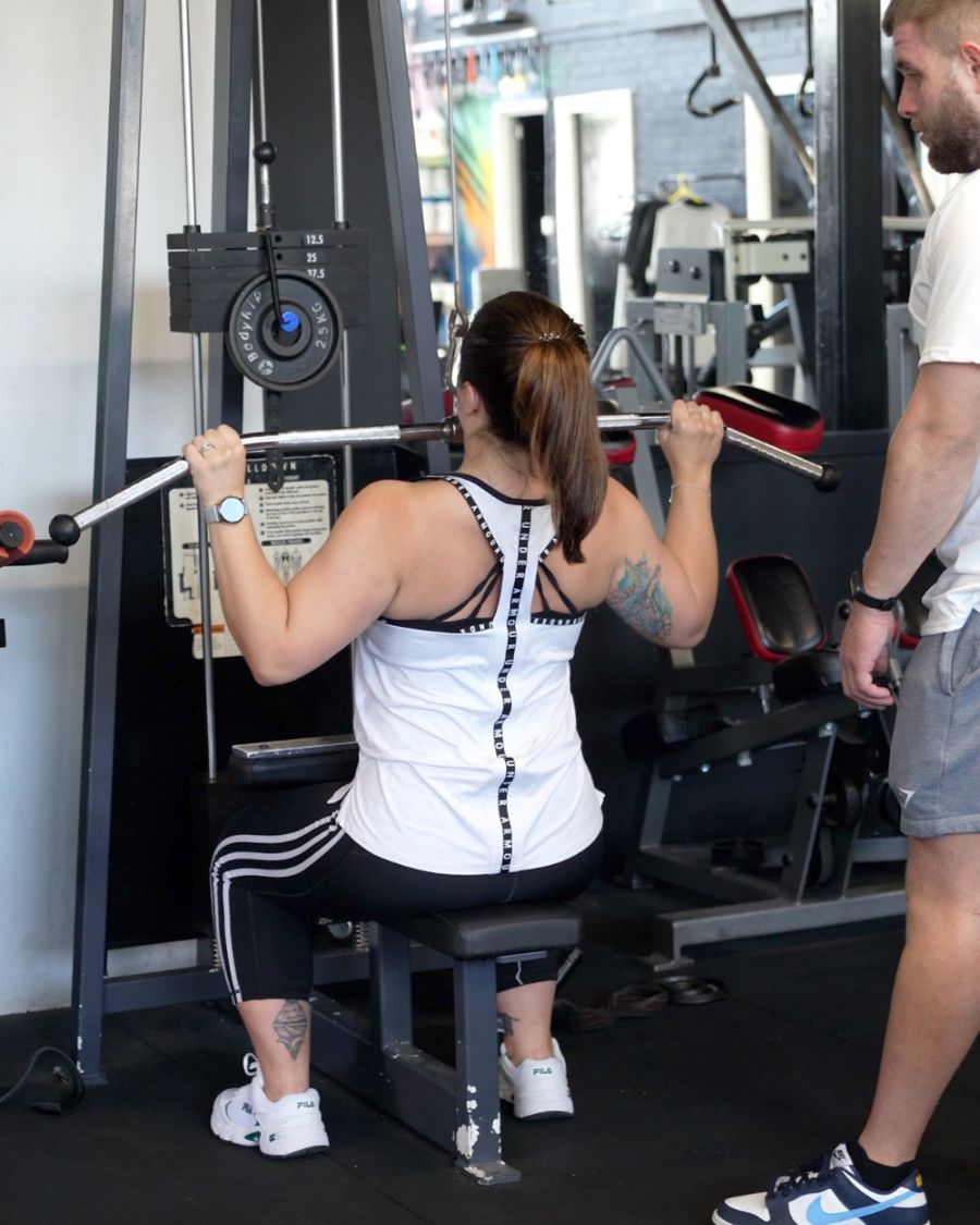 Coached lat pulldown session